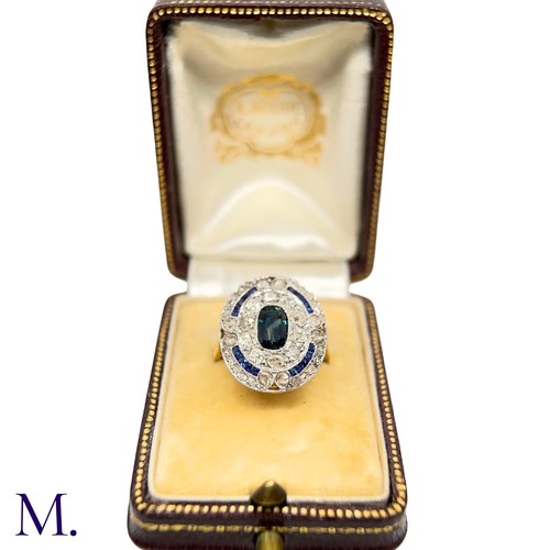 19 - A Sapphire and Diamond Cluster Ring

The 18ct gold ring is has a flat panel face set with an elongat... 