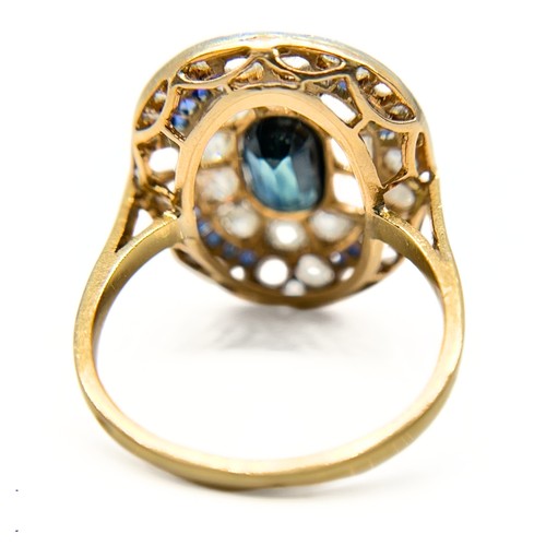 19 - A Sapphire and Diamond Cluster Ring

The 18ct gold ring is has a flat panel face set with an elongat... 