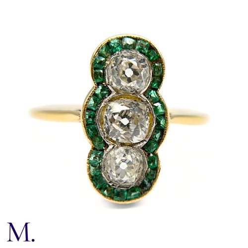 20 - A Calibre Emerald and Diamond Ring

The 18ct yellow gold ring is set with three principal old cut di... 