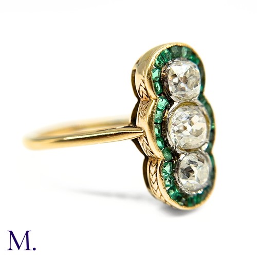 20 - A Calibre Emerald and Diamond Ring

The 18ct yellow gold ring is set with three principal old cut di... 