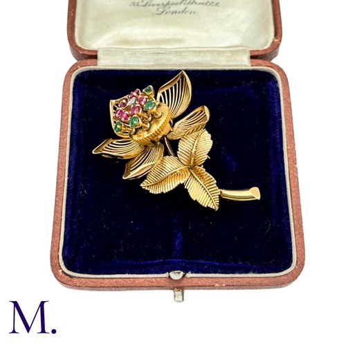 22 - A Fine Ruby, Diamond and Emerald Articulated Flower Brooch.

The 18ct yellow gold flower brooch is s... 