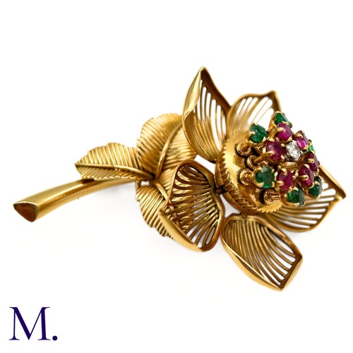 22 - A Fine Ruby, Diamond and Emerald Articulated Flower Brooch.

The 18ct yellow gold flower brooch is s... 