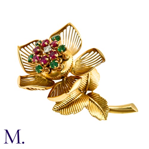 22 - A Fine Ruby, Diamond and Emerald Articulated Flower Brooch.

The 18ct yellow gold flower brooch is s... 