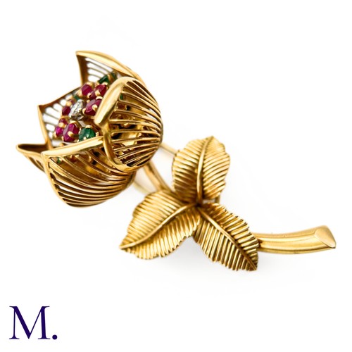 22 - A Fine Ruby, Diamond and Emerald Articulated Flower Brooch.

The 18ct yellow gold flower brooch is s... 