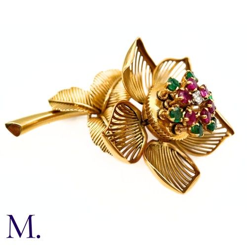 22 - A Fine Ruby, Diamond and Emerald Articulated Flower Brooch.

The 18ct yellow gold flower brooch is s... 