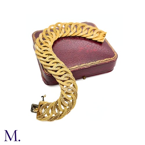 24 - A 18ct Gold Bracelet by Georges Lenfant

The gold woven bracelet by Georges Lenfant is of high quali... 