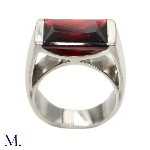 27 - A Garnet Ring by Poiray

The 18ct white gold ring by Parisian jeweller, Poiray, is set with a rectan... 