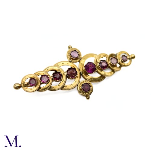 28 - An Antique French Garnet Brooch

The 18ct yellow gold brooch (approx. 55x25mm) takes the form of ove... 