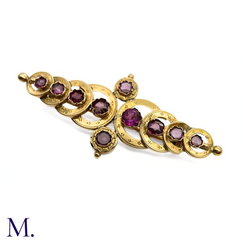 28 - An Antique French Garnet Brooch

The 18ct yellow gold brooch (approx. 55x25mm) takes the form of ove... 