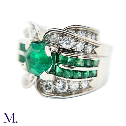 29 - A Colombian Emerald and Diamond Ring
Moderate Oil

The Colombian emerald is hexagonal cut (approx. 3... 