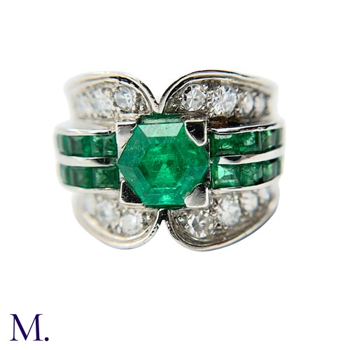 29 - A Colombian Emerald and Diamond Ring
Moderate Oil

The Colombian emerald is hexagonal cut (approx. 3... 