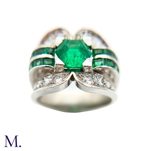 29 - A Colombian Emerald and Diamond Ring
Moderate Oil

The Colombian emerald is hexagonal cut (approx. 3... 