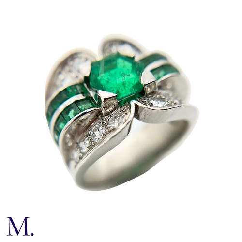 29 - A Colombian Emerald and Diamond Ring
Moderate Oil

The Colombian emerald is hexagonal cut (approx. 3... 