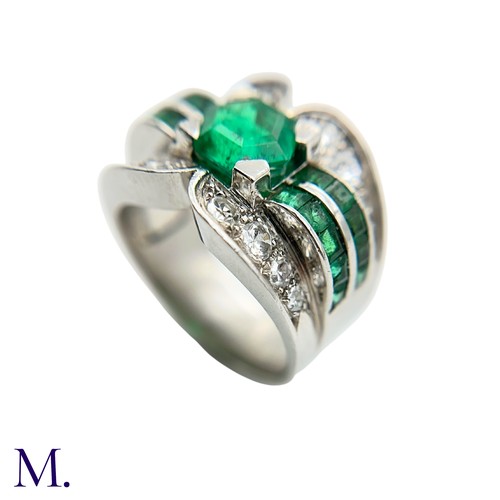 29 - A Colombian Emerald and Diamond Ring
Moderate Oil

The Colombian emerald is hexagonal cut (approx. 3... 