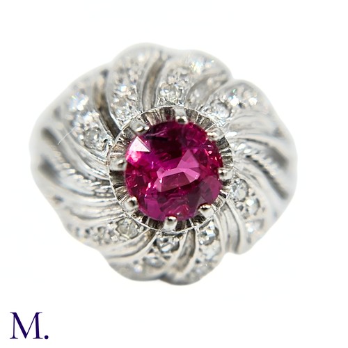 31 - A French Ruby and Diamond Tourbillon Ring

The platinum ring is set with a deep red, round cut ruby ... 