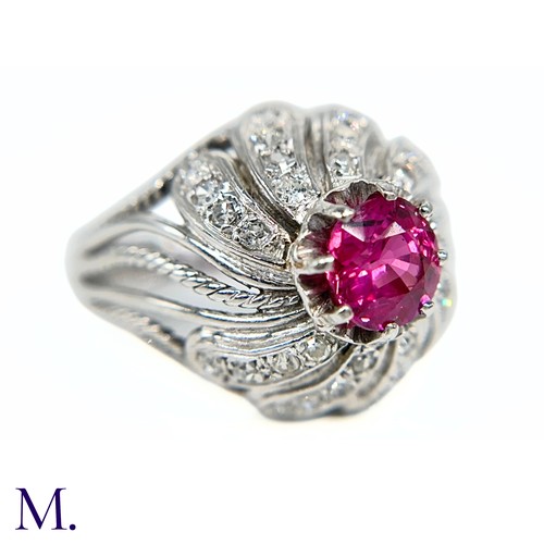 31 - A French Ruby and Diamond Tourbillon Ring

The platinum ring is set with a deep red, round cut ruby ... 