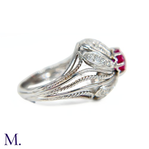 31 - A French Ruby and Diamond Tourbillon Ring

The platinum ring is set with a deep red, round cut ruby ... 