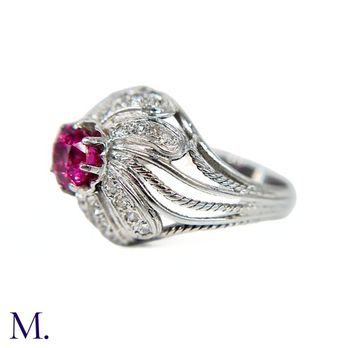 31 - A French Ruby and Diamond Tourbillon Ring

The platinum ring is set with a deep red, round cut ruby ... 