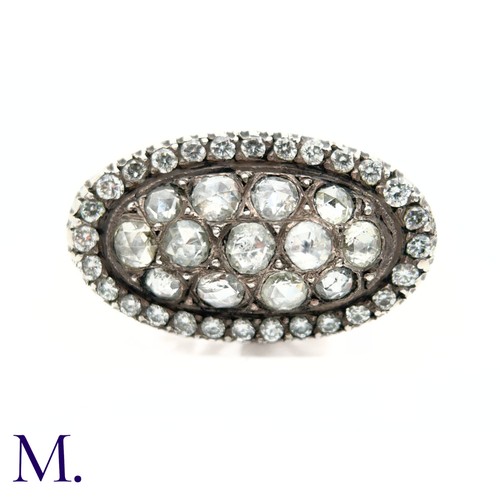 37 - An Antique Diamond Cluster Open-Work Ring.

The antique ring has a closed-back oval face set with th... 