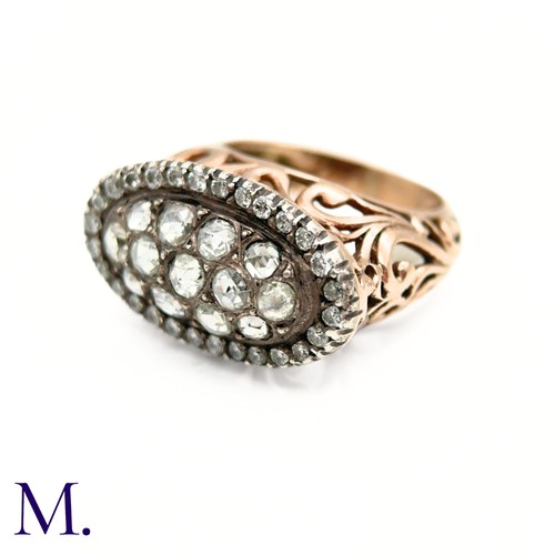 37 - An Antique Diamond Cluster Open-Work Ring.

The antique ring has a closed-back oval face set with th... 