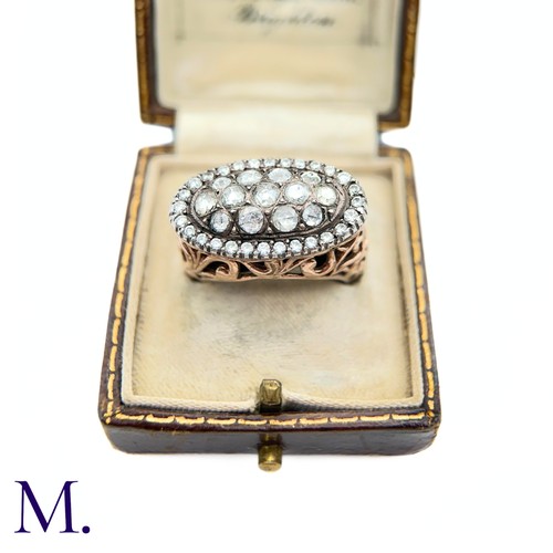 37 - An Antique Diamond Cluster Open-Work Ring.

The antique ring has a closed-back oval face set with th... 