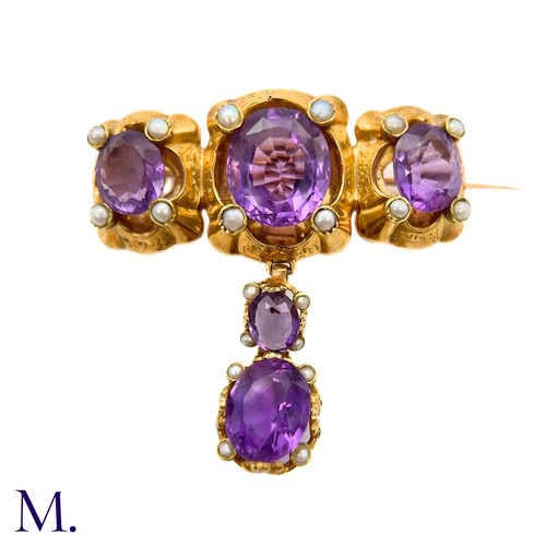 47 - An Antique Amethyst and Pearl Drop Brooch

The large antique 18ct gold brooch is set with five ameth... 