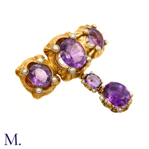 47 - An Antique Amethyst and Pearl Drop Brooch

The large antique 18ct gold brooch is set with five ameth... 