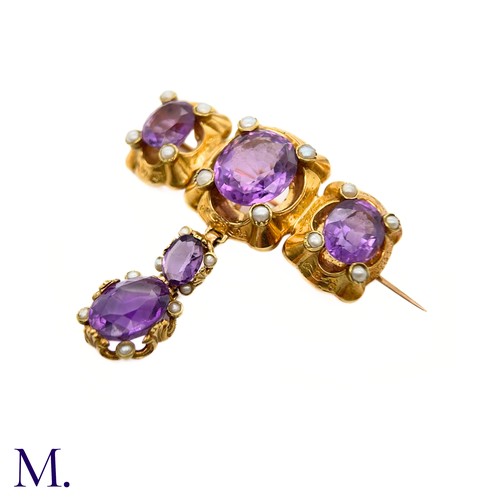 47 - An Antique Amethyst and Pearl Drop Brooch

The large antique 18ct gold brooch is set with five ameth... 