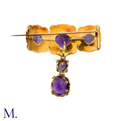 47 - An Antique Amethyst and Pearl Drop Brooch

The large antique 18ct gold brooch is set with five ameth... 