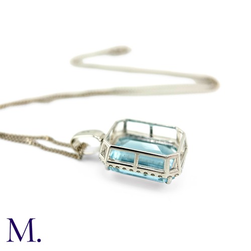 50 - An Aquamarine and Diamond Pendant and Chain.

The fine aquamarine of approximately 9.5ct is surround... 