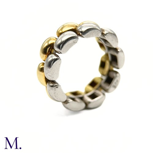 55 - A Gold and Silver Ring by Chopard

The 18ct yellow gold and silver ring is by Chopard.  The band is ... 