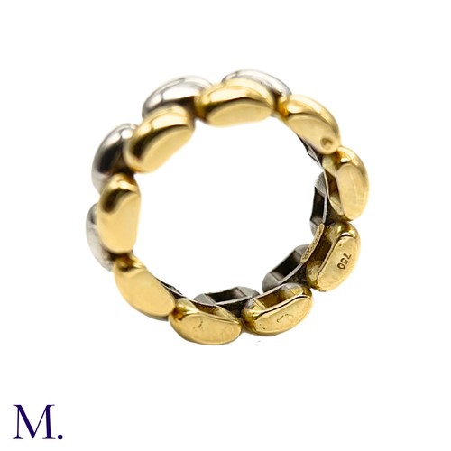 55 - A Gold and Silver Ring by Chopard

The 18ct yellow gold and silver ring is by Chopard.  The band is ... 