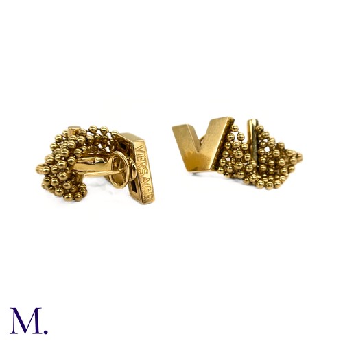 60 - A Pair of 18ct Gold Earclips by Versace

The 18ct yellow gold earclips by Versace have the iconic 'V... 