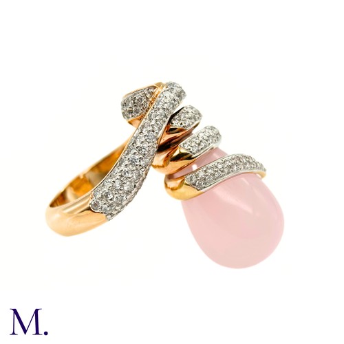 62 - A Pink Quartz and Diamond Ring by Grisogno

The 18ct yellow gold ring takes an open swirling form an... 