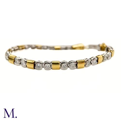 66 - A Two-Colour Gold and Diamond Bracelet

The 18ct gold bracelet is made up of square yellow gold and ... 