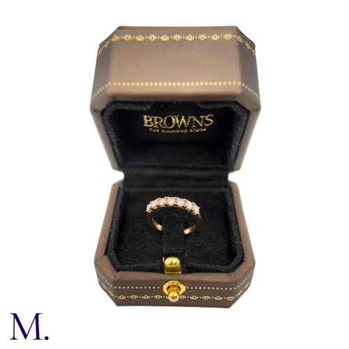 45 - A Diamond ring by Browns 

The 18ct yellow gold band is set with seven brilliant cut diamonds weighi... 