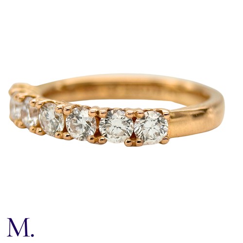 45 - A Diamond ring by Browns 

The 18ct yellow gold band is set with seven brilliant cut diamonds weighi... 