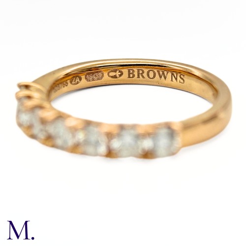 45 - A Diamond ring by Browns 

The 18ct yellow gold band is set with seven brilliant cut diamonds weighi... 