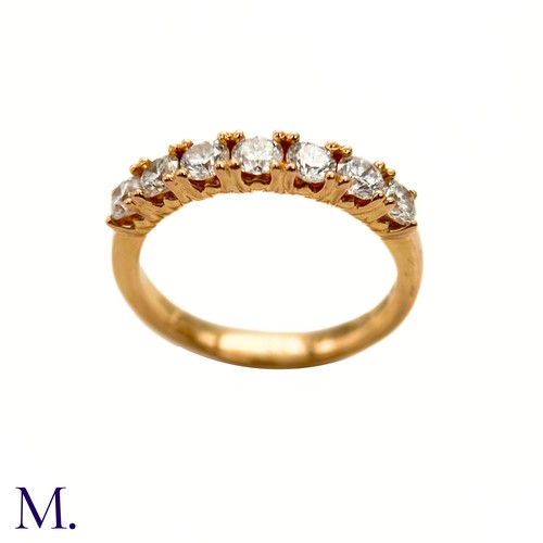 45 - A Diamond ring by Browns 

The 18ct yellow gold band is set with seven brilliant cut diamonds weighi... 