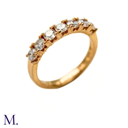 45 - A Diamond ring by Browns 

The 18ct yellow gold band is set with seven brilliant cut diamonds weighi... 