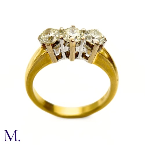 65 - A 3-Stone Diamond  Ring

The 18ct yellow gold ring is set with three round cut diamonds, each weighi... 