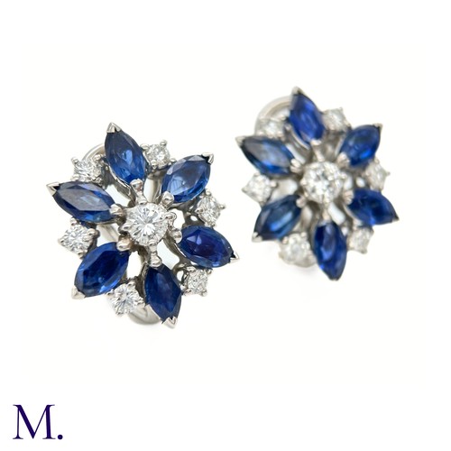 44 - A Pair of Sapphire and Diamond Cluster Earrings

The 18ct white gold earrings are each set with appr... 