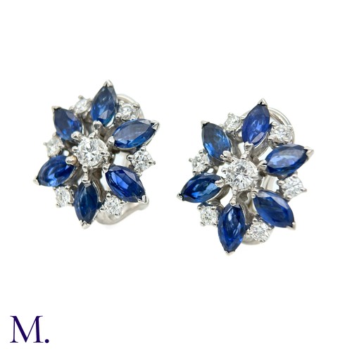 44 - A Pair of Sapphire and Diamond Cluster Earrings

The 18ct white gold earrings are each set with appr... 