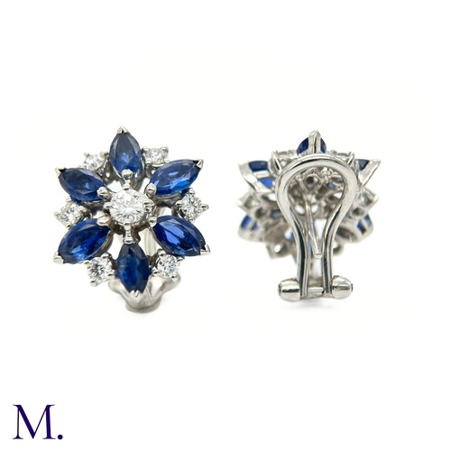 44 - A Pair of Sapphire and Diamond Cluster Earrings

The 18ct white gold earrings are each set with appr... 