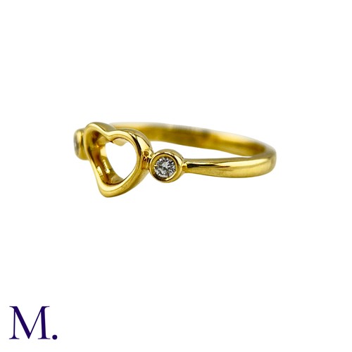 102 - An Open Heart Ring by Elsa Peretti for Tiffany & Co. 

The 18ct yellow gold ring is marked for Tiffa... 