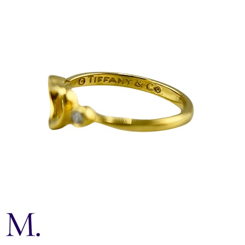 102 - An Open Heart Ring by Elsa Peretti for Tiffany & Co. 

The 18ct yellow gold ring is marked for Tiffa... 