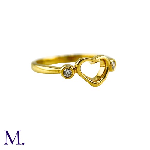 102 - An Open Heart Ring by Elsa Peretti for Tiffany & Co. 

The 18ct yellow gold ring is marked for Tiffa... 