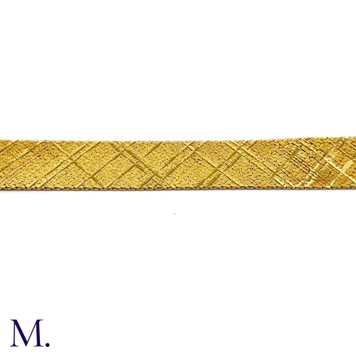 112 - A Gold Woven Bracelet by Georges Lenfant.

The 18ct yellow gold bracelet in woven and striated patte... 