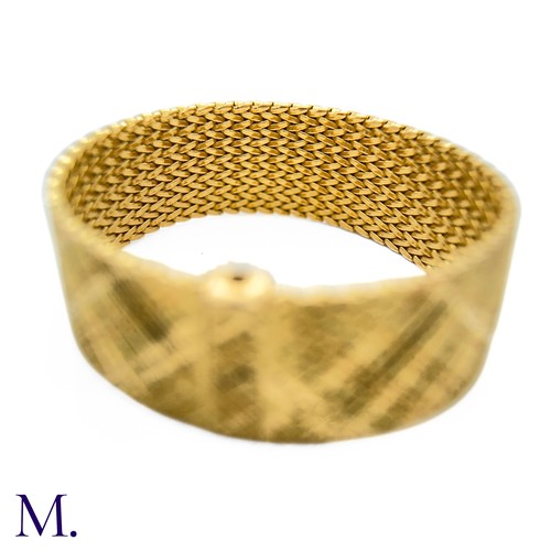 112 - A Gold Woven Bracelet by Georges Lenfant.

The 18ct yellow gold bracelet in woven and striated patte... 