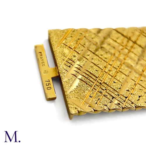 112 - A Gold Woven Bracelet by Georges Lenfant.

The 18ct yellow gold bracelet in woven and striated patte... 